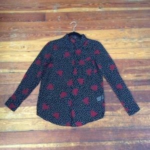 Women’s sized button down dress shirt.